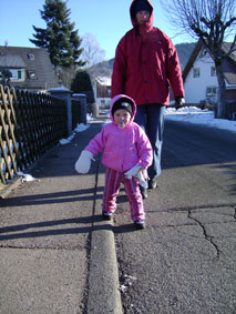 Walking to town.  Only one glove on because your other hand needs to hold your 'bunny'